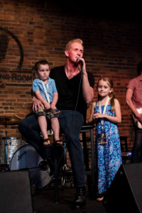 Devin McGlamery performs "While I Still Can," with a little help from his children, Preston (L) and Karlyn (R) during the release concert for Love Is A Verb, at The Listening Room CafÃ© in Nashville, TN  // Photo: Joshua Clark Photography