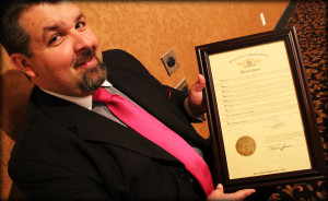 Jonathan Edwards holds a framed proclamation from the State of the Missouri, honoring The Lesters for 89 years of distinguished service in gospel music.