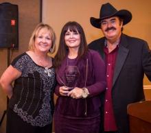 Bev McCann and Lynn Fox pose with TV host Melanie Walker (center). During the USAGEM banquet, Melanie received the USAGEM Film & TV Award. As a Christian Country artist and speaker, Melanie is also known for her work with the TCT Network. 