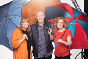 The Talleys sing in the rain in their "Grab Your Umbrella" video