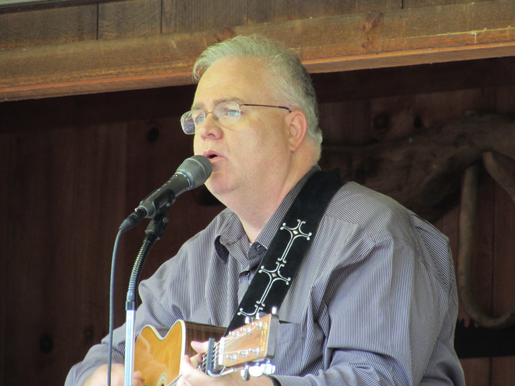 Les Butler playing and singing at Hominy Valley